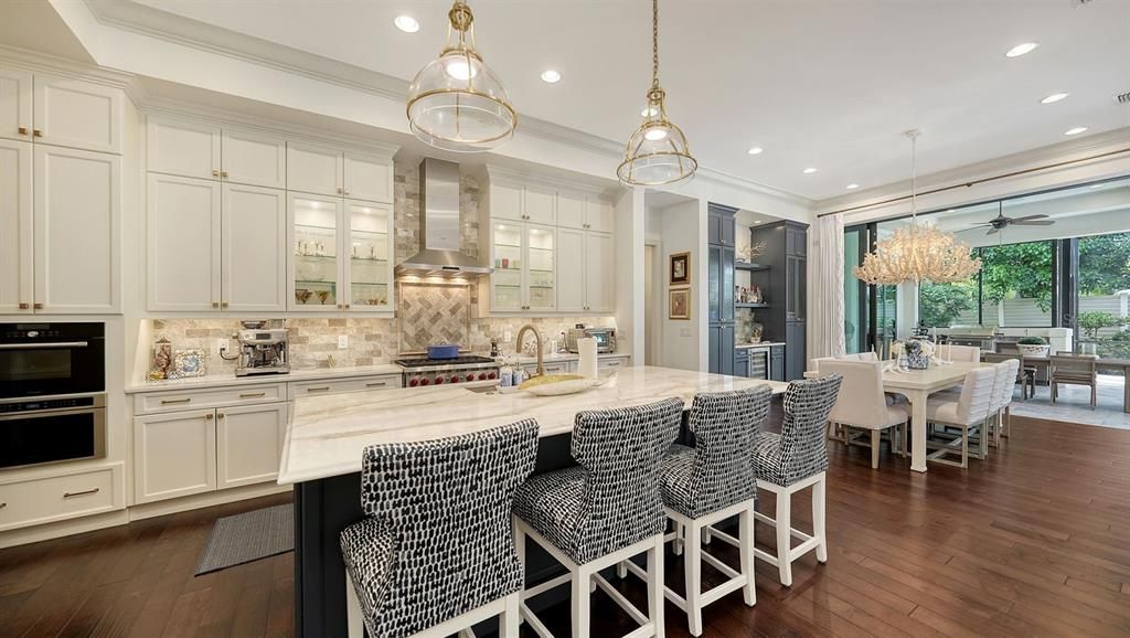 Chandelier, Dining room, Interior, Kitchen, Pendant Lights, Recessed Lighting, Stainless Steel Appliances, Wood Texture Flooring