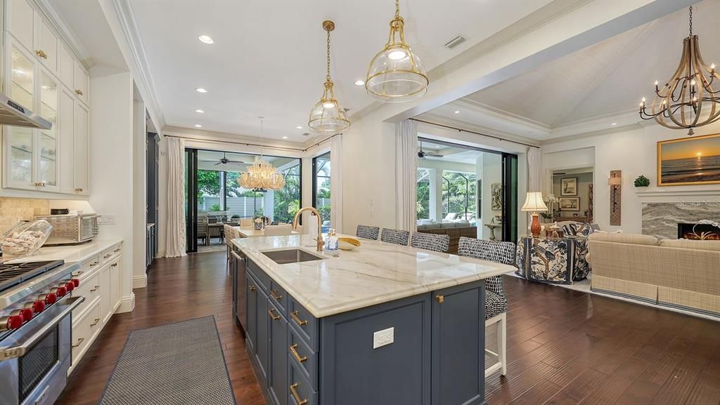 Chandelier, Dining room, Fireplace, Interior, Kitchen, Living room, Pendant Lights, Recessed Lighting, Wood Texture Flooring