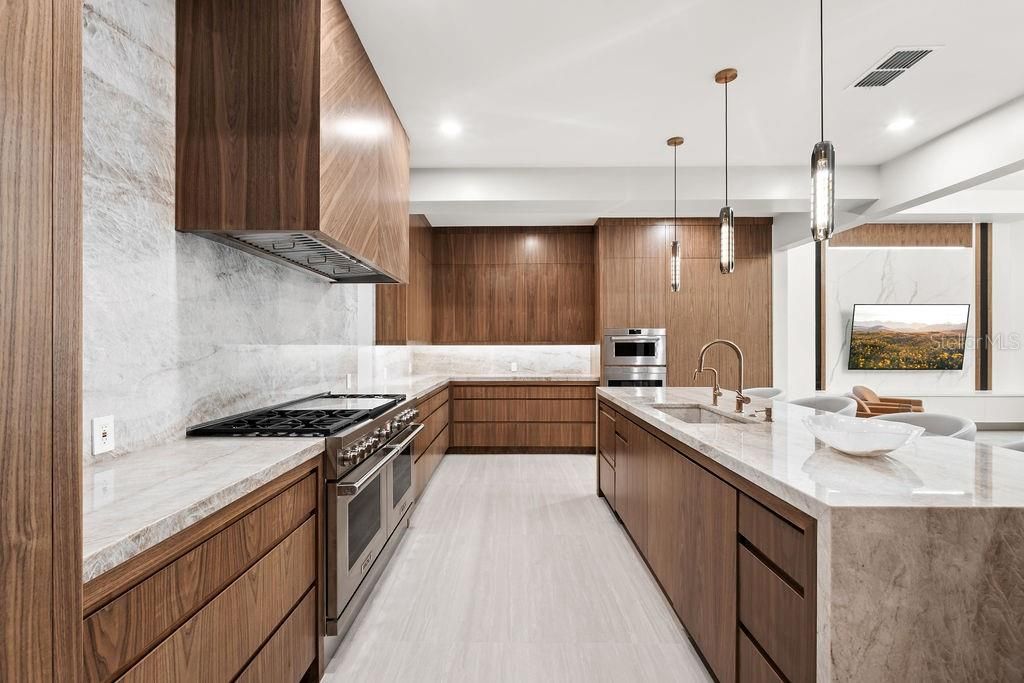 Interior, Kitchen, Marble Walls, Pendant Lights, Recessed Lighting, Stainless Steel Appliances