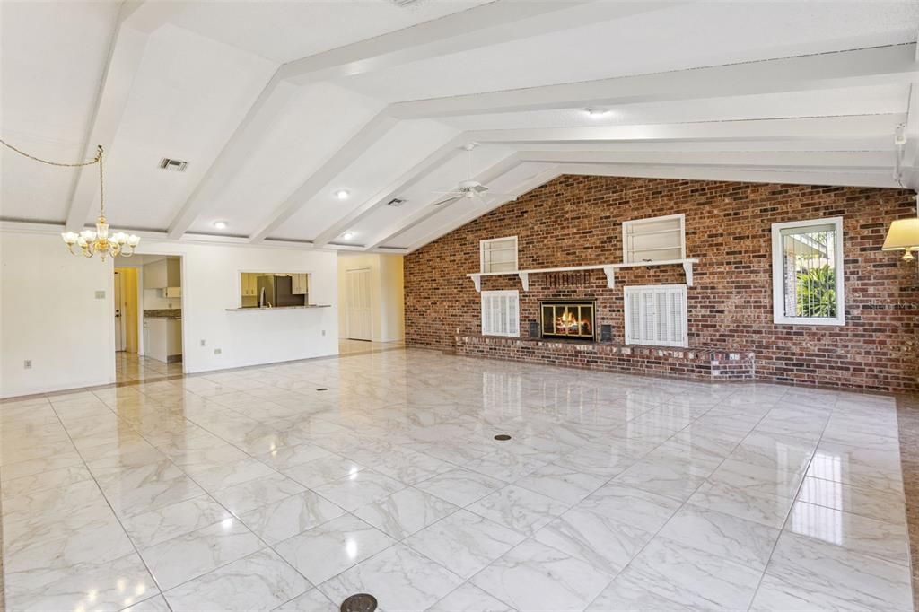 Chandelier, Empty room, Fireplace, Interior, Marble, Recessed Lighting, Stone Walls