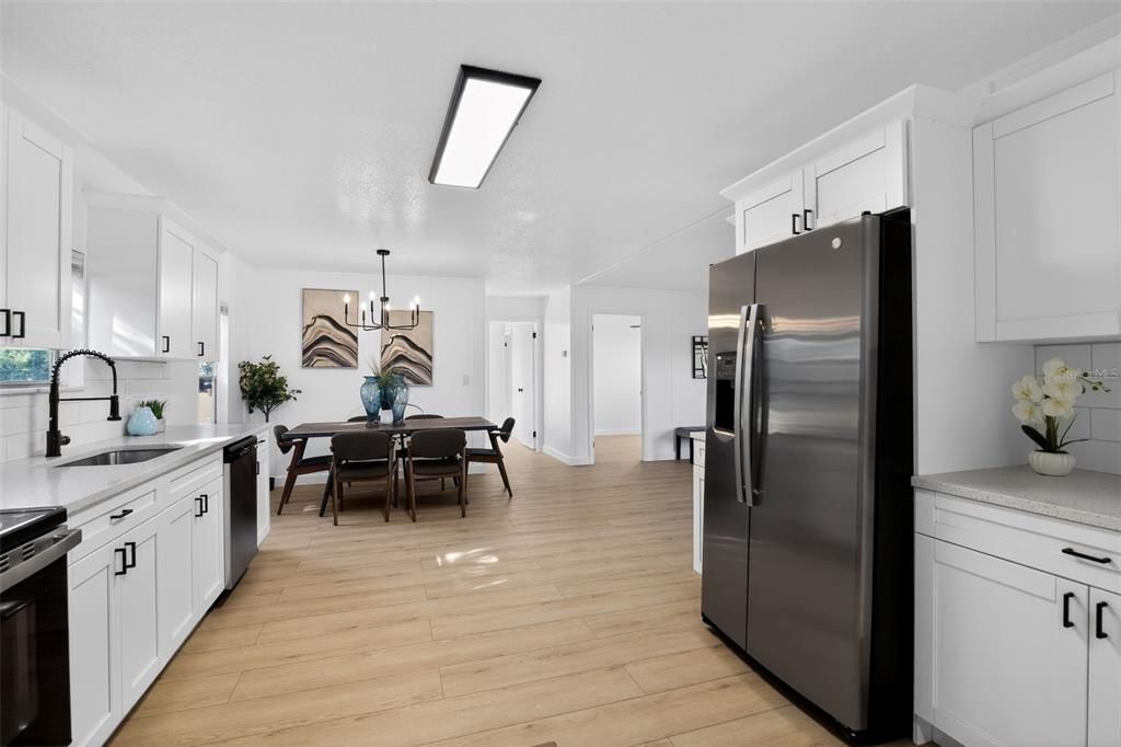 Dining room, Interior, Kitchen, Pendant Lights, Stainless Steel Appliances, Wood Texture Flooring