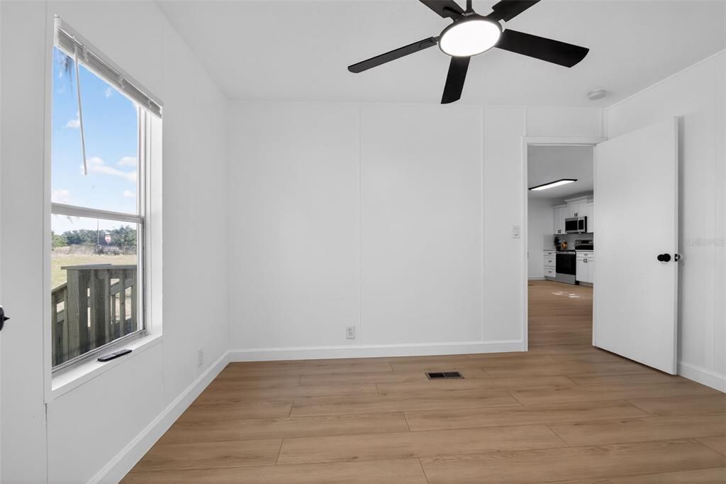 Empty room, Interior, Kitchen, Stainless Steel Appliances, Wood Texture Flooring
