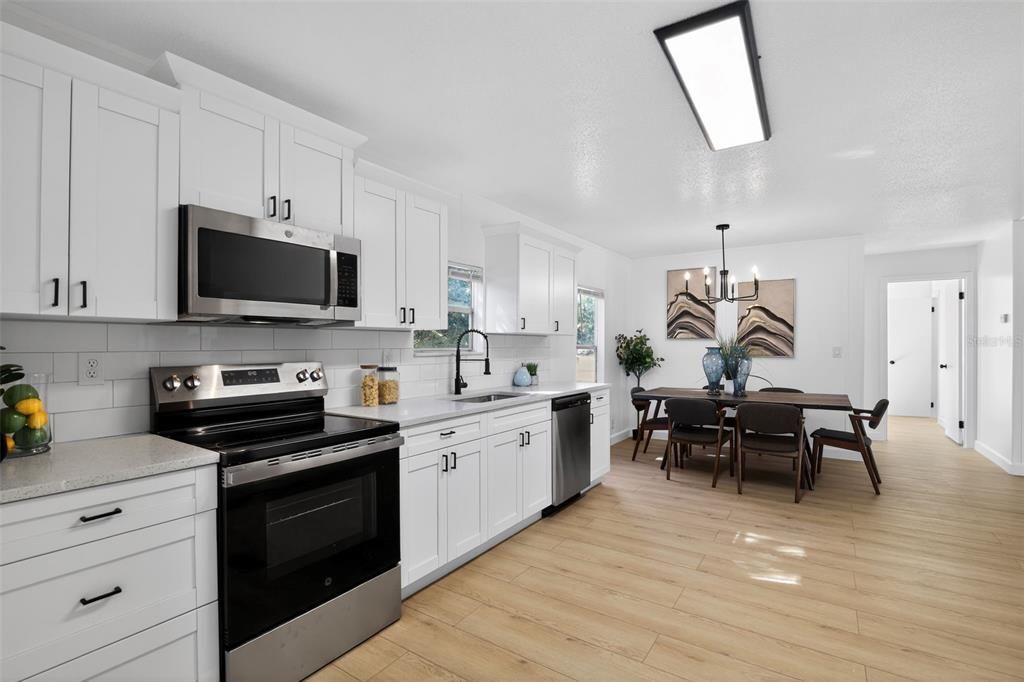 Dining room, Interior, Kitchen, Pendant Lights, Stainless Steel Appliances, Wood Texture Flooring