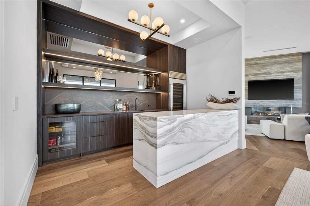 Fireplace, Interior, Kitchen, Living room, Pendant Lights, Recessed Lighting, Stainless Steel Appliances, Wood Texture Flooring