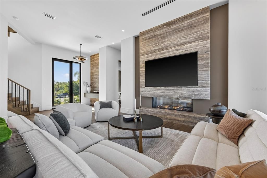 Fireplace, Interior, Living room, Pendant Lights, Recessed Lighting, Stone Walls, Wood Texture Flooring