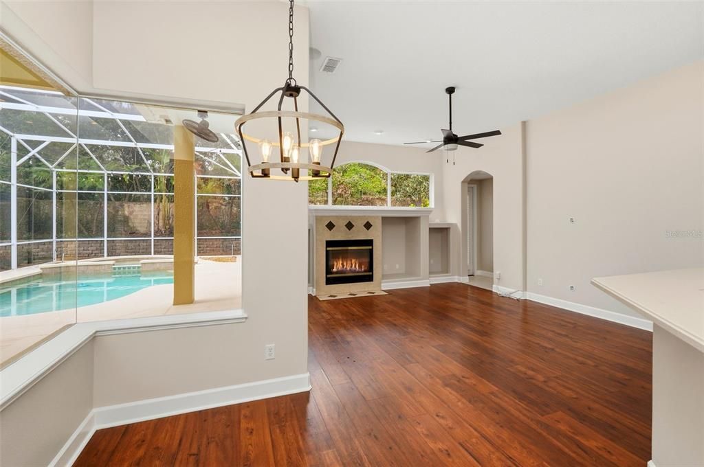 Fireplace, Glass Ceilings, Interior, Pendant Lights, Pool, Recessed Lighting, Sun Room, Wood Texture Flooring