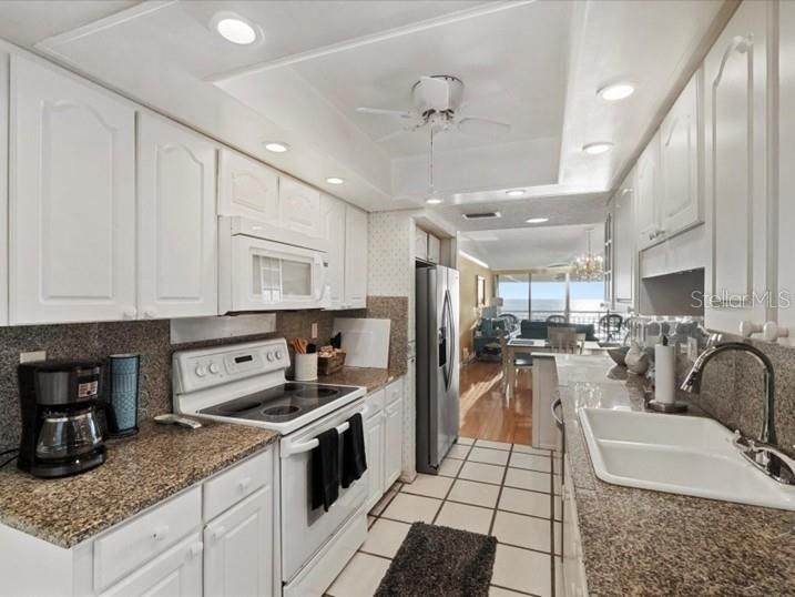 Chandelier, Dining room, Interior, Kitchen, Living room, Recessed Lighting, Wood Texture Flooring