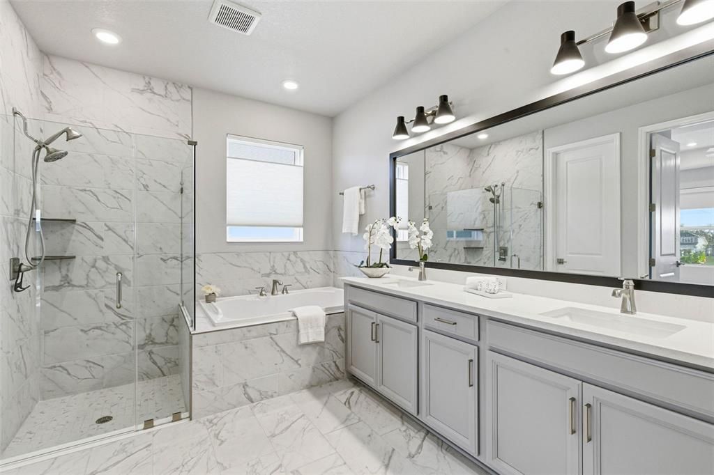 Bathroom, Dual Sink Vanities, Glass Shower, Interior, Marble, Marble Walls, Recessed Lighting