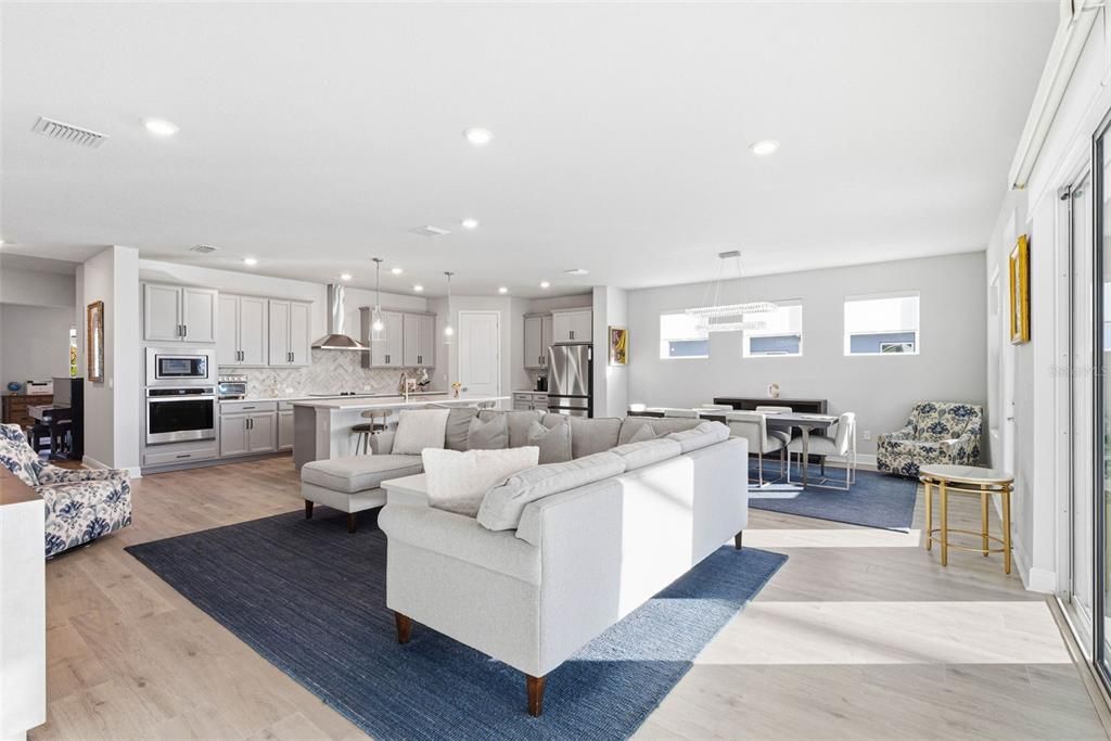 Dining room, Interior, Kitchen, Living room, Pendant Lights, Recessed Lighting, Stainless Steel Appliances, Wood Texture Flooring