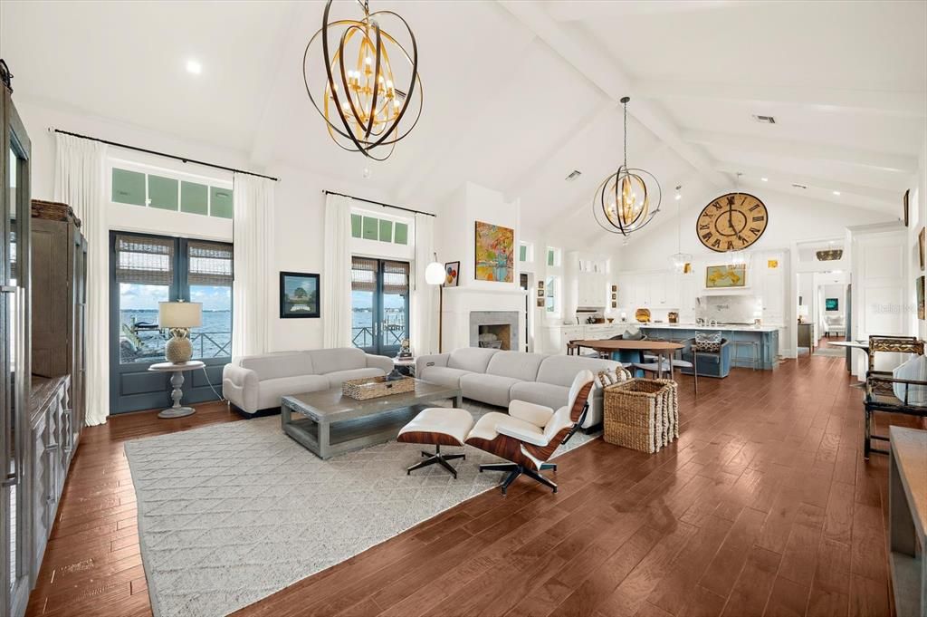 Chandelier, Fireplace, Interior, Kitchen, Living room, Pendant Lights, Recessed Lighting, Wood Texture Flooring