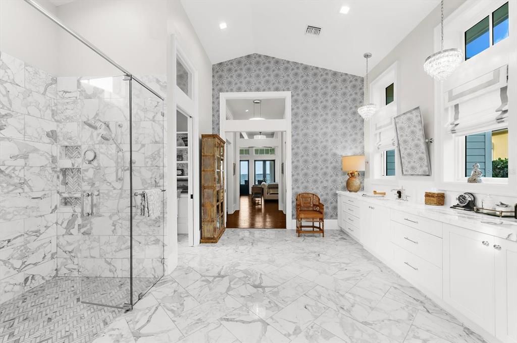 Bathroom, Chandelier, Dual Sink Vanities, Glass Shower, Interior, Marble, Marble Walls, Pendant Lights, Recessed Lighting
