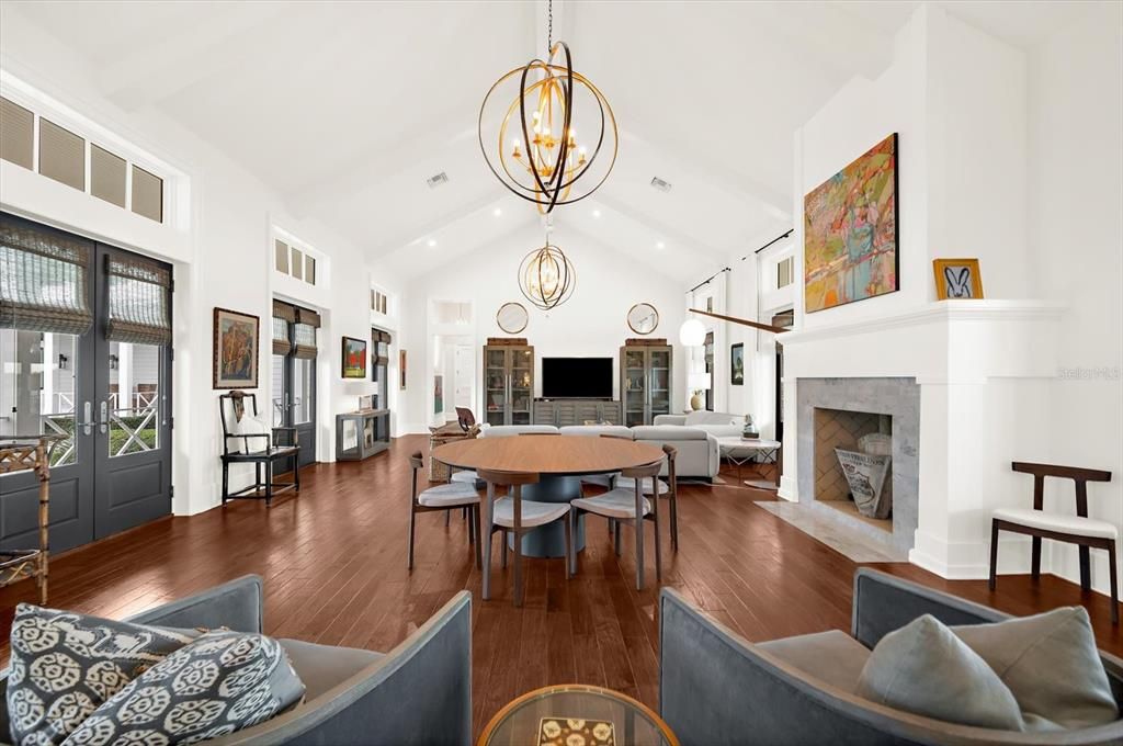 Chandelier, Dining room, Fireplace, Interior, Living room, Pendant Lights, Recessed Lighting, Wood Texture Flooring