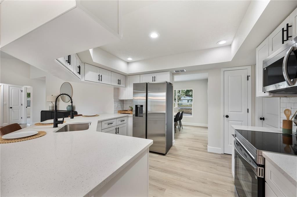 Interior, Kitchen, Recessed Lighting, Stainless Steel Appliances, Wood Texture Flooring