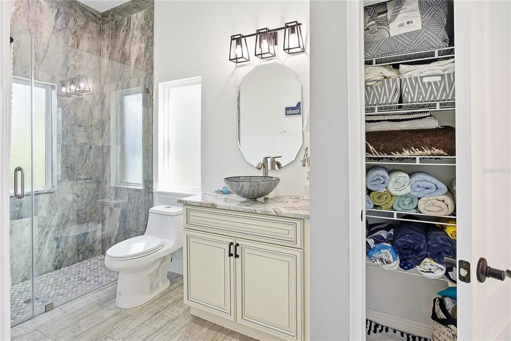 Bathroom, Glass Shower, Interior, Marble Walls, Wood Texture Flooring