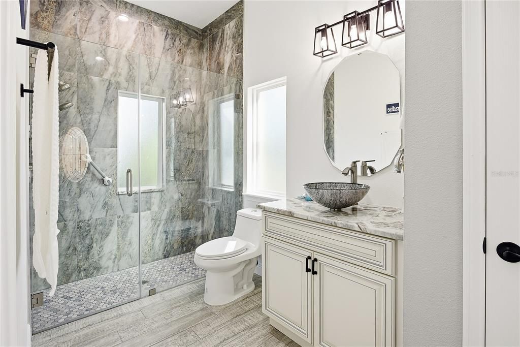 Bathroom, Glass Shower, Interior, Marble Walls, Wood Texture Flooring