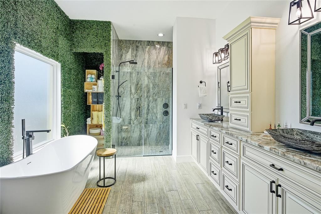 Bathroom, Dual Sink Vanities, Free Standing Baths, Glass Shower, Interior, Marble Walls, Recessed Lighting, Wood Texture Flooring