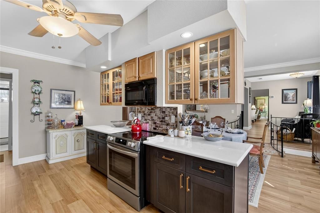 Dining room, Interior, Kitchen, Recessed Lighting, Stainless Steel Appliances, Wood Texture Flooring