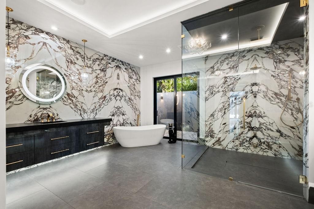 Bathroom, Dual Sink Vanities, Free Standing Baths, Glass Shower, Interior, Marble Walls, Recessed Lighting