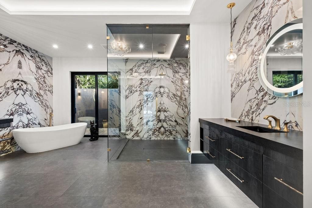 Bathroom, Dual Sink Vanities, Free Standing Baths, Glass Shower, Interior, Marble Walls, Pendant Lights, Recessed Lighting