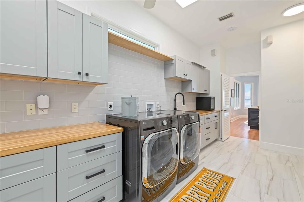 Interior, Kitchen, Marble, Recessed Lighting, Washer, Wood Texture Flooring