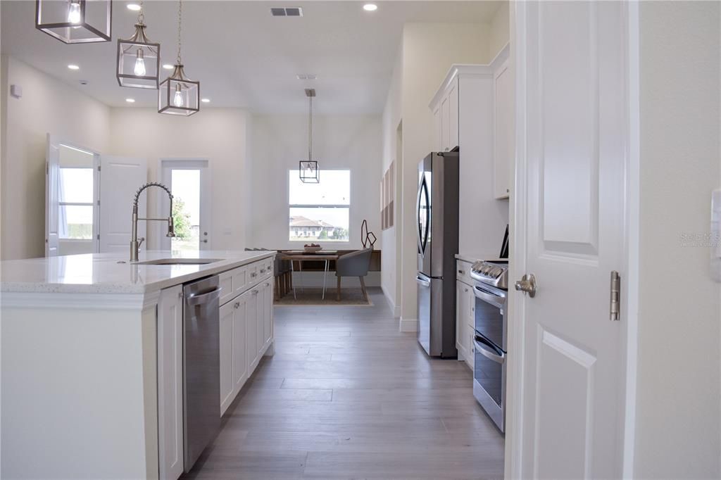 Interior, Kitchen, Pendant Lights, Recessed Lighting, Stainless Steel Appliances, Wood Texture Flooring