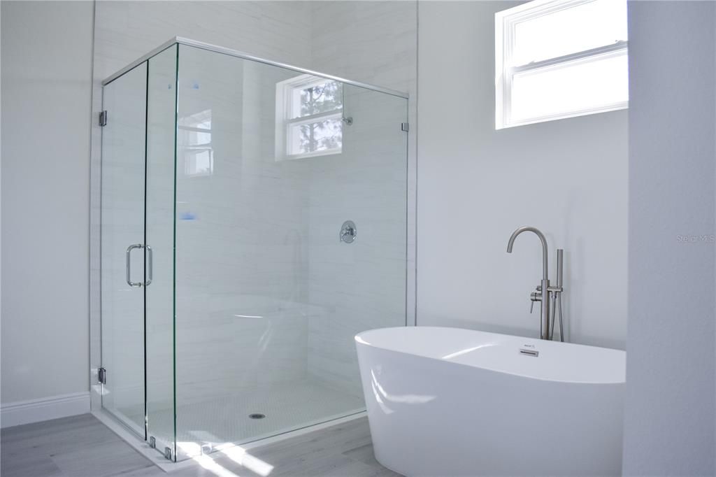 Bathroom, Free Standing Baths, Glass Shower, Interior, Marble Walls, Wood Texture Flooring