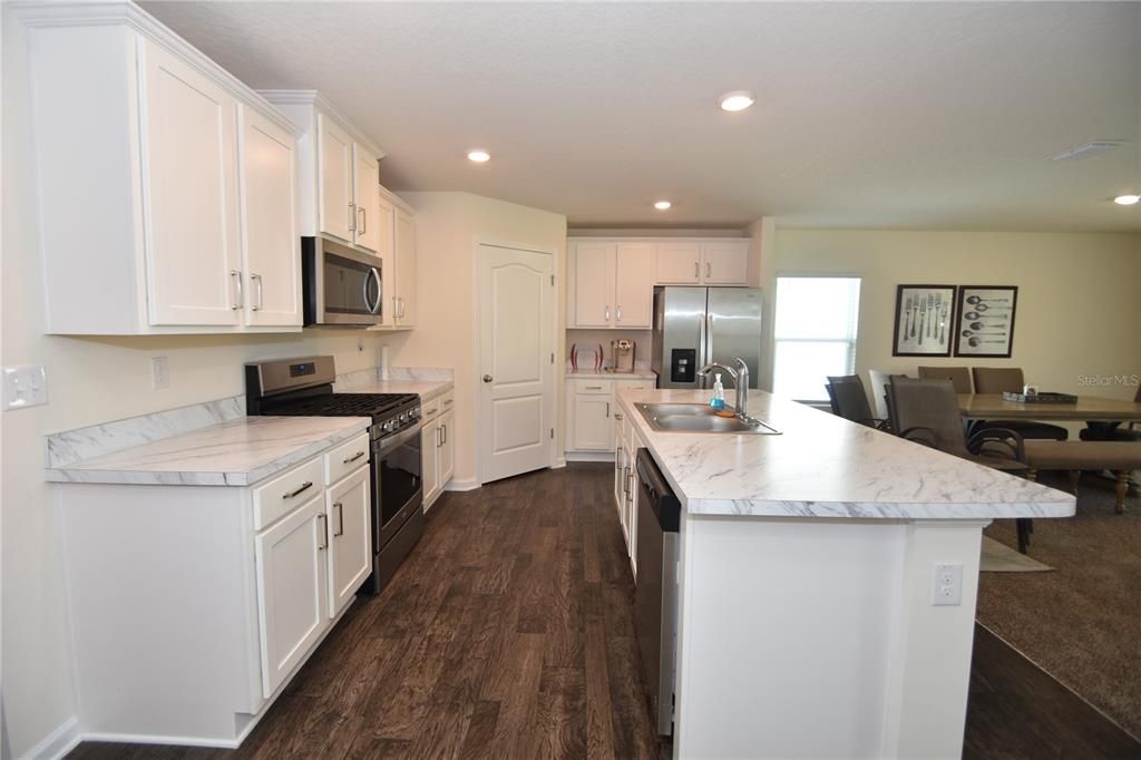 Dining room, Interior, Kitchen, Recessed Lighting, Stainless Steel Appliances, Wood Texture Flooring