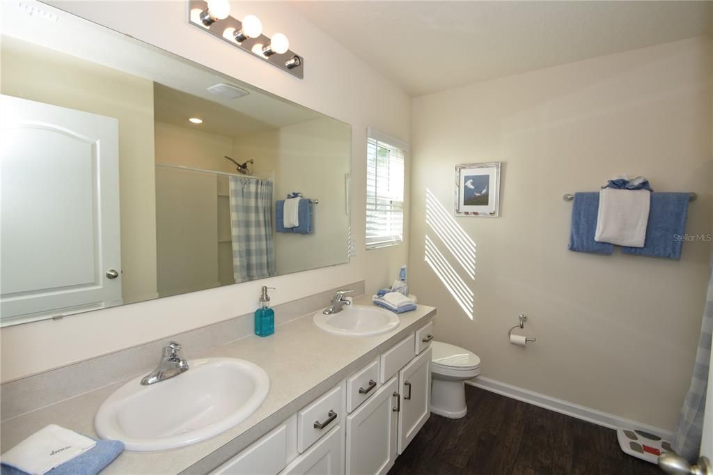 Bathroom, Dual Sink Vanities, Interior, Recessed Lighting, Wood Texture Flooring
