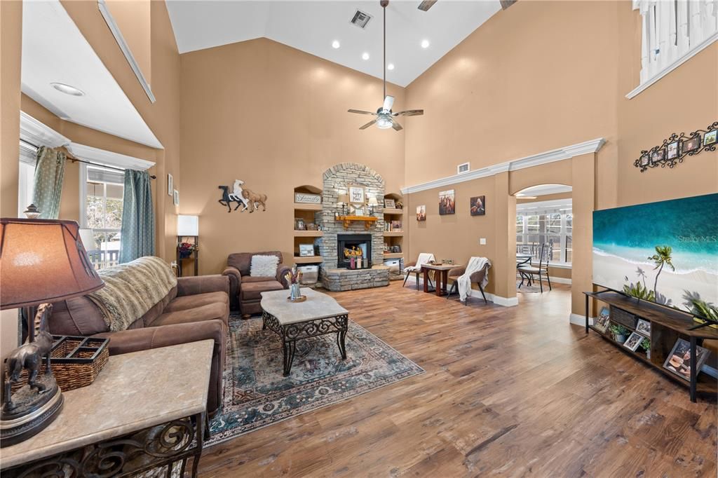 Dining room, Fireplace, Interior, Living room, Recessed Lighting, Wood Texture Flooring