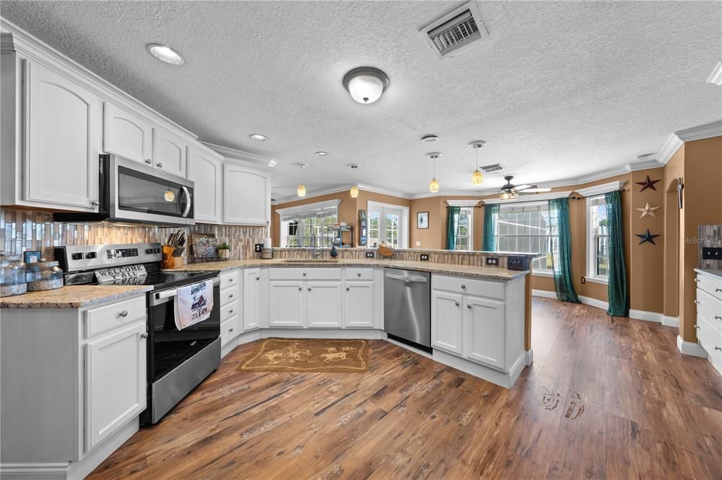 Interior, Kitchen, Pendant Lights, Recessed Lighting, Stainless Steel Appliances, Wood Texture Flooring