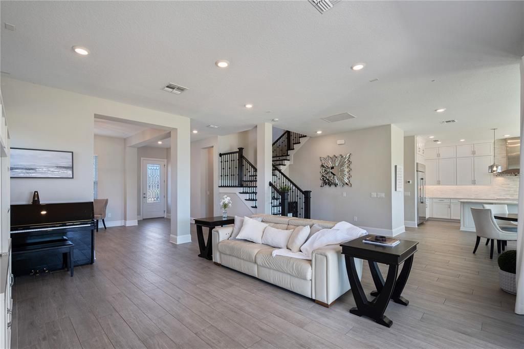 Dining room, Interior, Kitchen, Living room, Pendant Lights, Piano, Recessed Lighting, Wood Texture Flooring