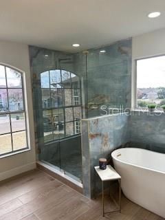Bathroom, Free Standing Baths, Glass Shower, Interior, Recessed Lighting, Wood Texture Flooring