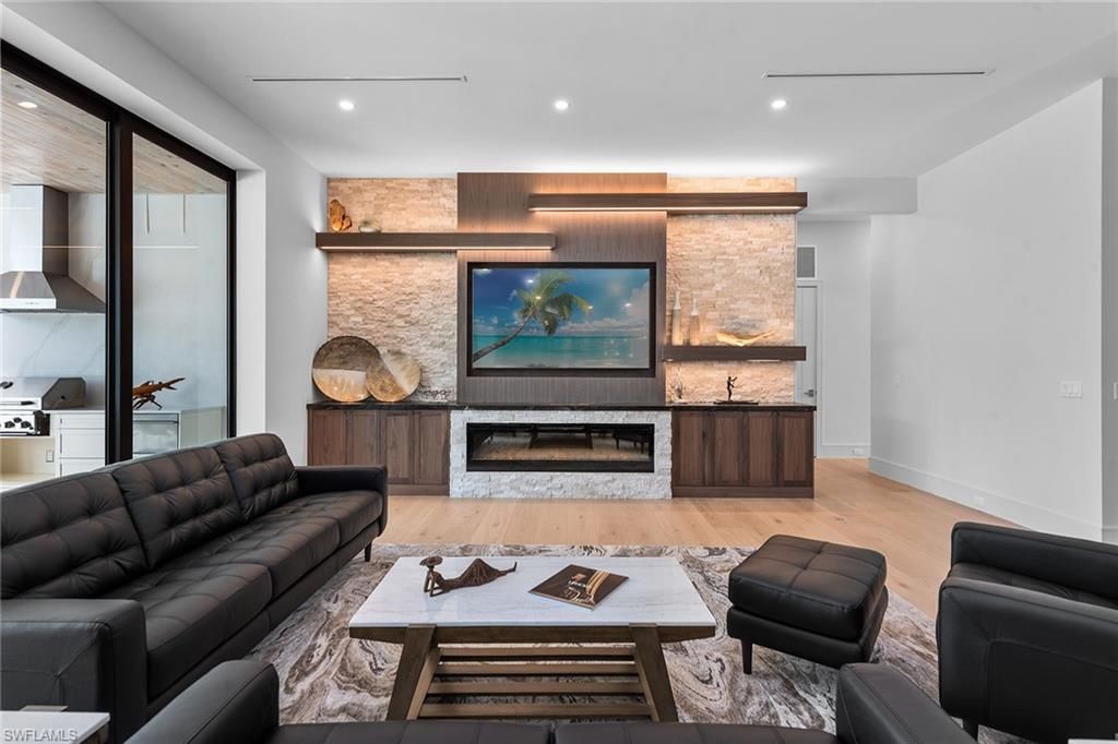 Fireplace, Interior, Living room, Recessed Lighting, Stone Walls, Wood Texture Flooring