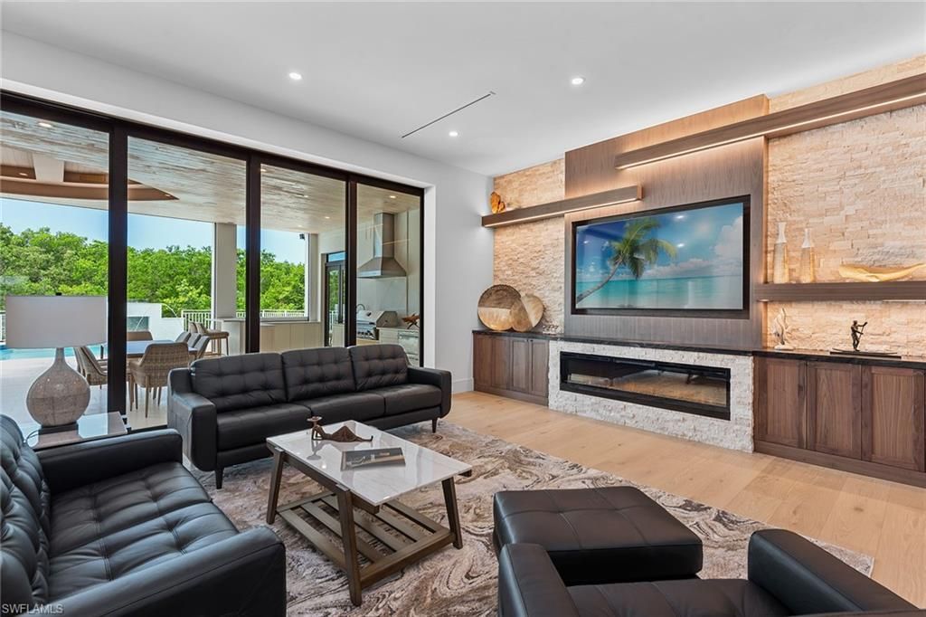 Fireplace, Interior, Living room, Recessed Lighting, Stone Walls, Wood Texture Flooring