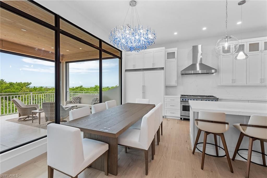 Chandelier, Dining room, Interior, Kitchen, Pendant Lights, Recessed Lighting, Stainless Steel Appliances, Wood Texture Flooring