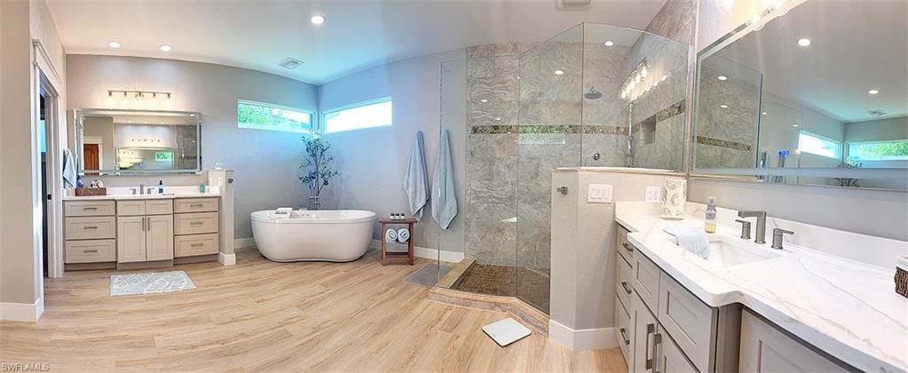 Bathroom, Dual Sink Vanities, Free Standing Baths, Glass Shower, Interior, Recessed Lighting, Wood Texture Flooring