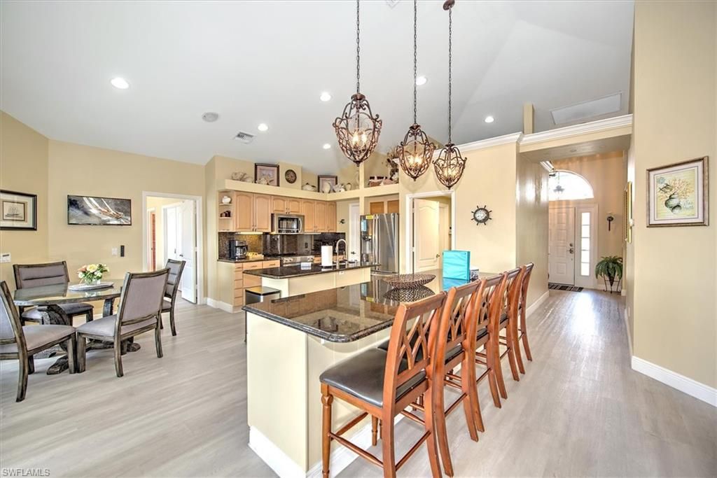 Chandelier, Dining room, Interior, Kitchen, Pendant Lights, Recessed Lighting, Stainless Steel Appliances, Wood Texture Flooring