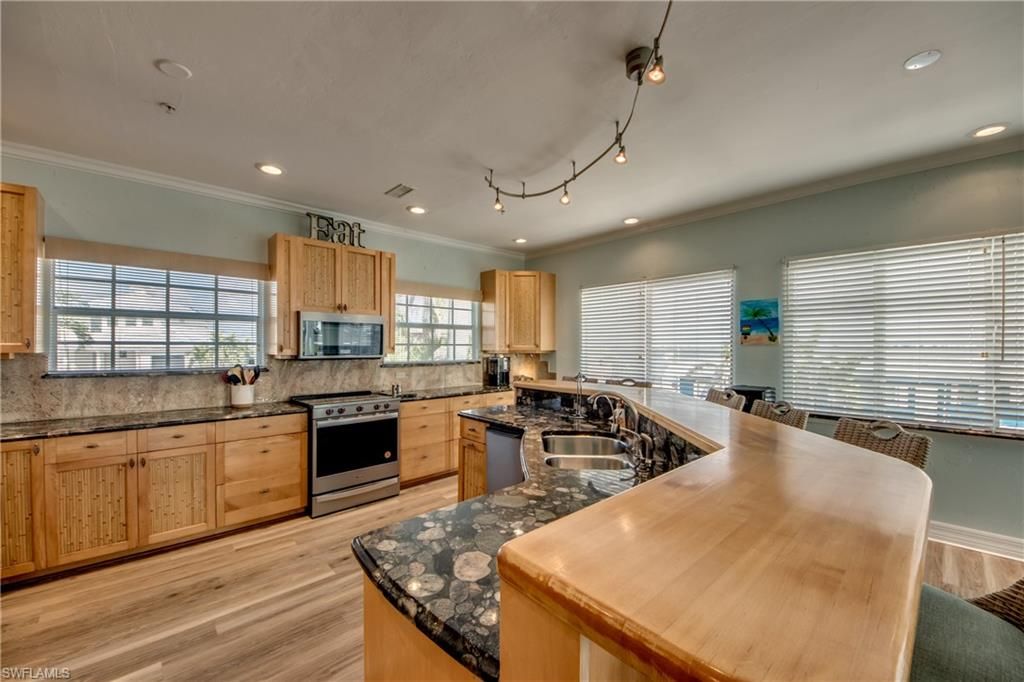 Dining room, Interior, Kitchen, Recessed Lighting, Stainless Steel Appliances, Wood Texture Flooring