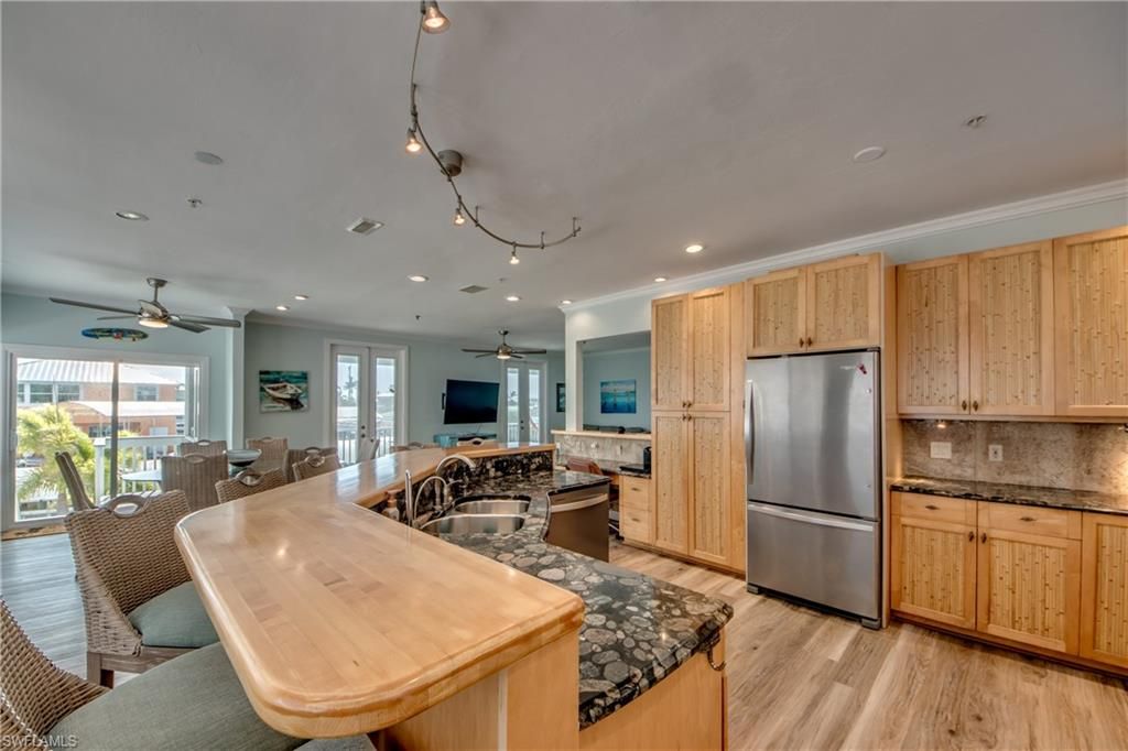 Dining room, Interior, Kitchen, Recessed Lighting, Stainless Steel Appliances, Wood Texture Flooring