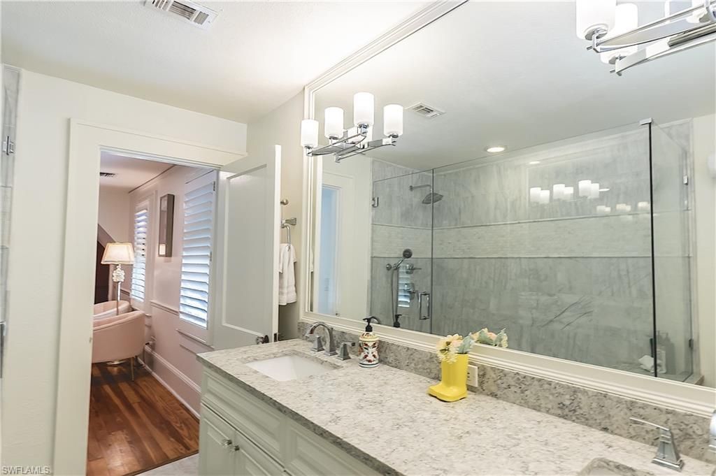 Bathroom, Dual Sink Vanities, Glass Shower, Interior, Recessed Lighting, Wood Texture Flooring
