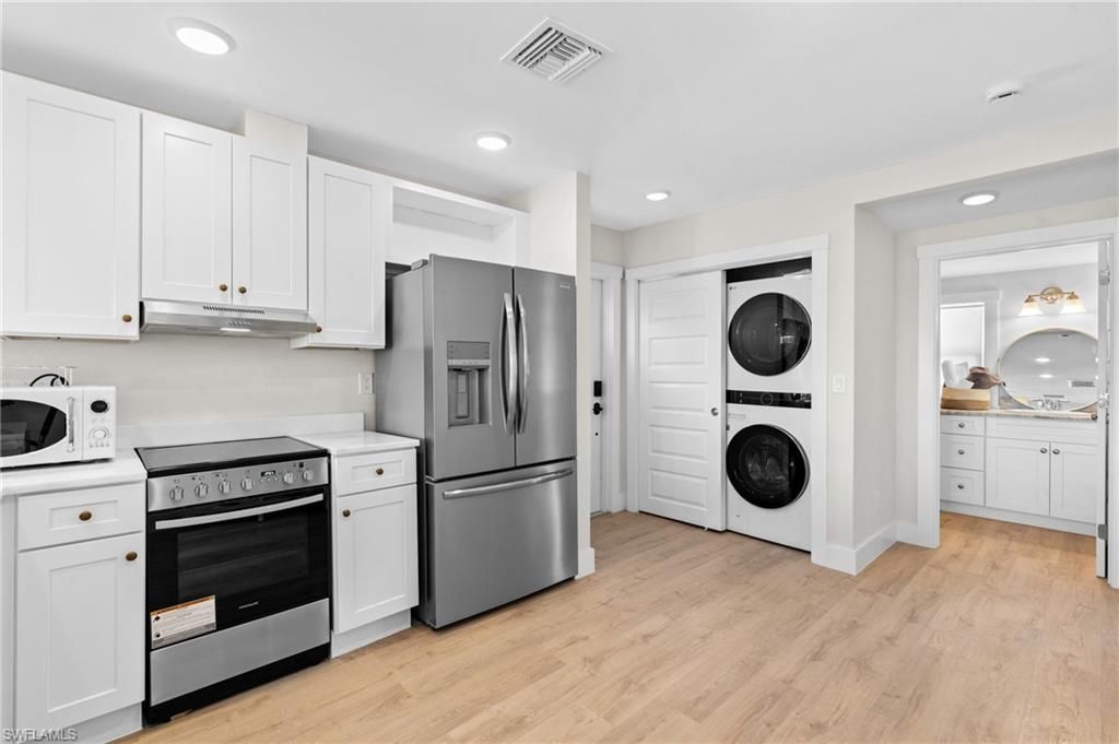 Interior, Kitchen, Recessed Lighting, Stainless Steel Appliances, Washer, Wood Texture Flooring
