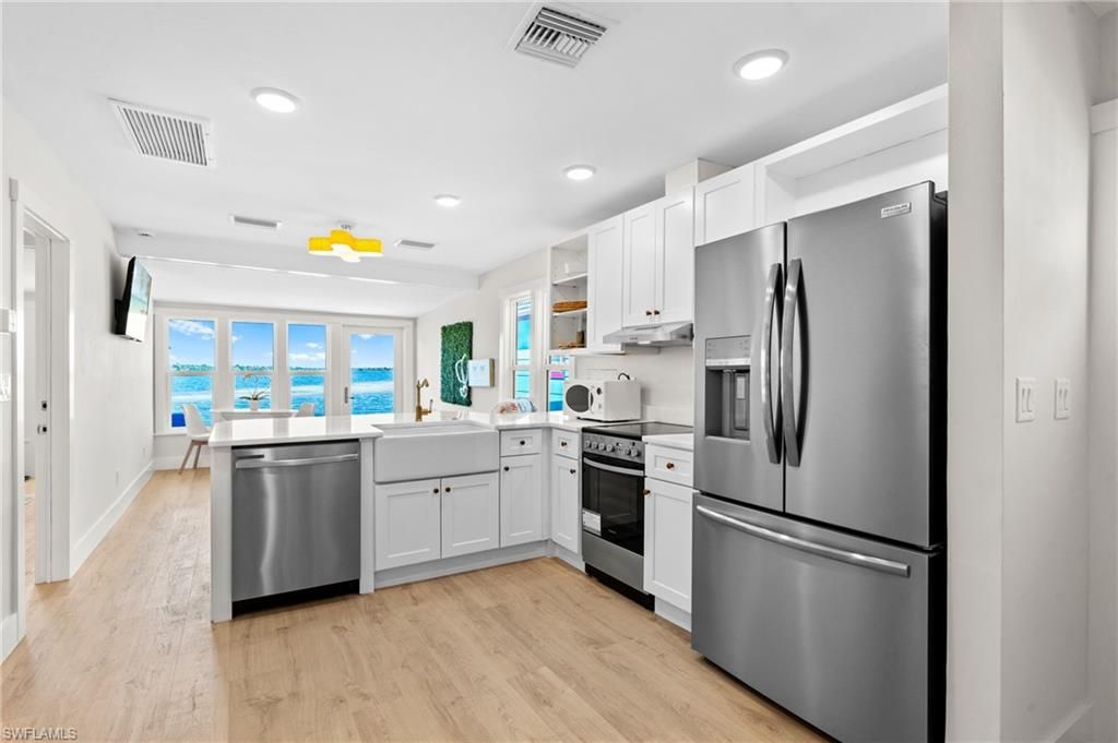 Interior, Kitchen, Recessed Lighting, Stainless Steel Appliances, Water, Wood Texture Flooring