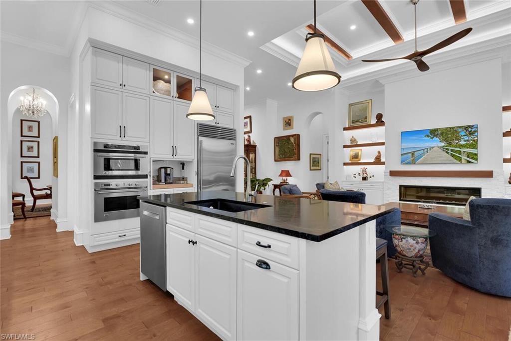 Fireplace, Interior, Kitchen, Pendant Lights, Recessed Lighting, Stainless Steel Appliances, Wood Texture Flooring
