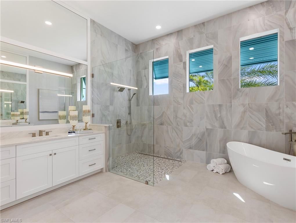 Bathroom, Dual Sink Vanities, Free Standing Baths, Glass Shower, Interior, Marble Walls, Recessed Lighting