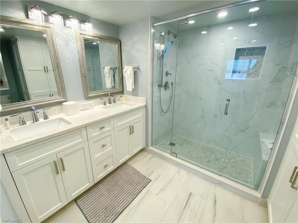 Bathroom, Dual Sink Vanities, Glass Shower, Interior, Marble, Marble Walls, Recessed Lighting