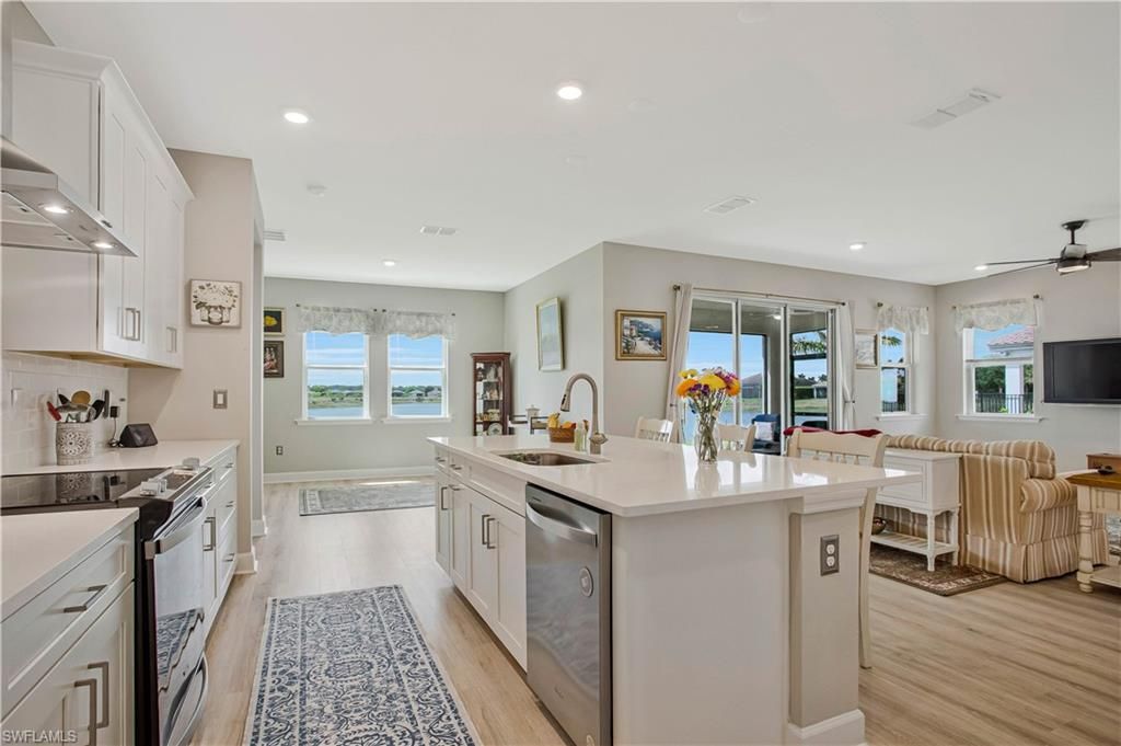 Dining room, Interior, Kitchen, Living room, Recessed Lighting, Water, Wood Texture Flooring