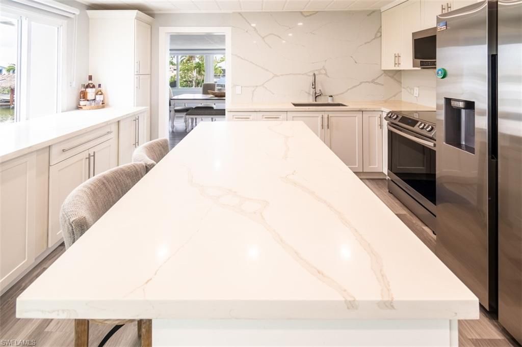 Interior, Kitchen, Marble Walls, Stainless Steel Appliances, Wood Texture Flooring