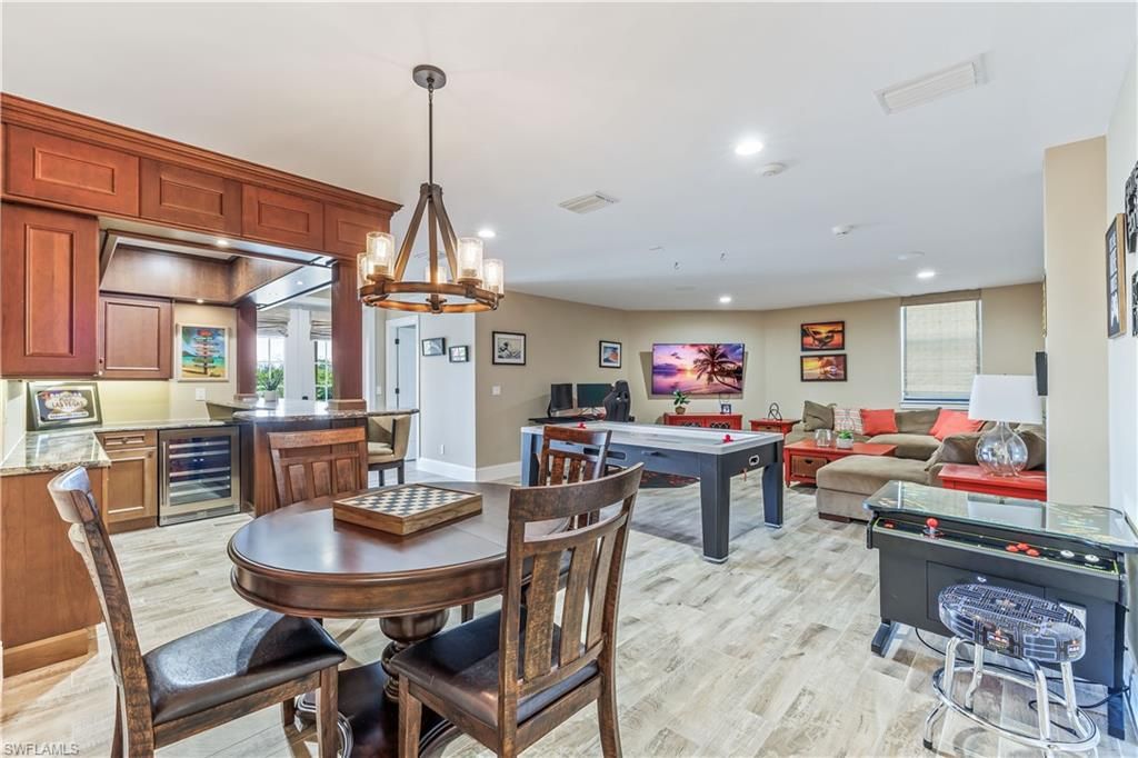 Billiard Table, Chandelier, Dining room, Game Room, Interior, Kitchen, Living room, Pendant Lights, Recessed Lighting, Wood Texture Flooring