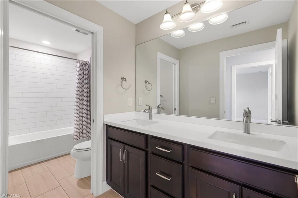 Bathroom, Dual Sink Vanities, Interior, Recessed Lighting, Wood Texture Flooring