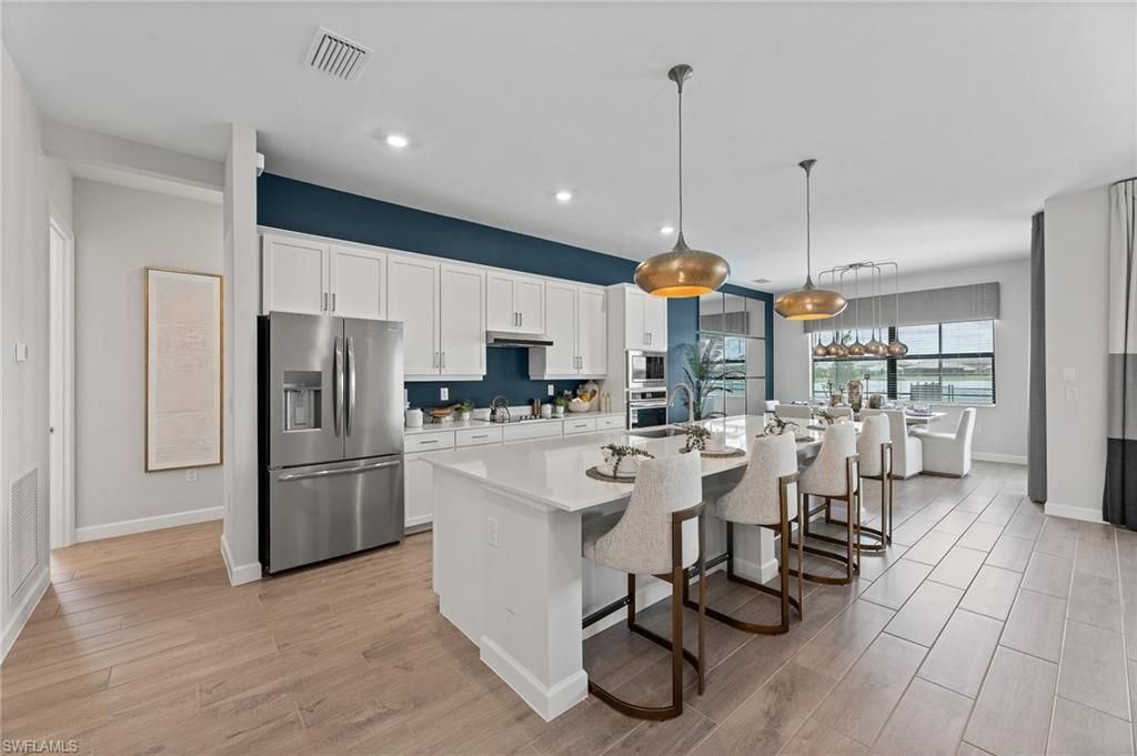 Dining room, Interior, Kitchen, Pendant Lights, Recessed Lighting, Stainless Steel Appliances, Wood Texture Flooring